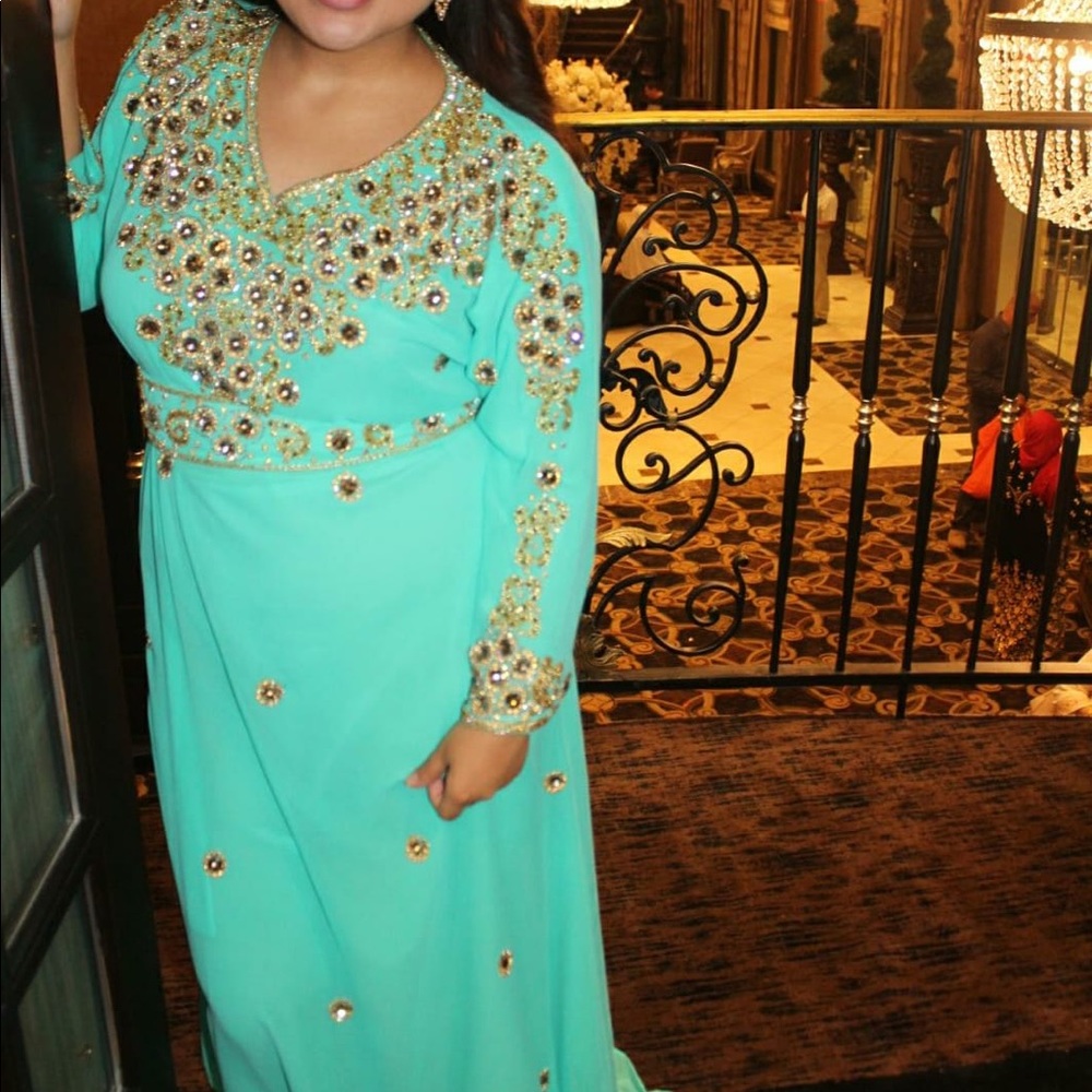 Beautiful dress with gold details.